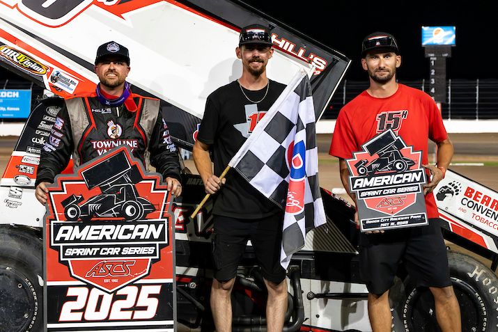 Sam Hafertepe Jr. standing in Victory Lane beside Hill's Racing crew members Cody Fidler and AJ Butler