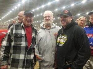 Emmett Hahn, Don Swope and Tony Stewart posing for a photo in the infield of the Tulsa Expo Raceway at the Chili Bolw Nationals