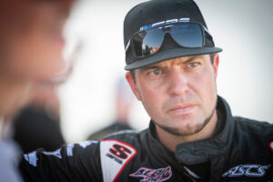 A candid photo of Zach Blurton in the pit area at an American Sprint Car Series event
