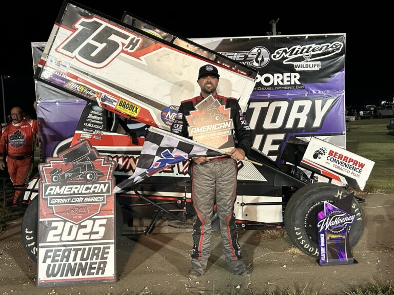 Sam Hafertepe Jr. standing in Victory Lane at WaKeeney Speedway