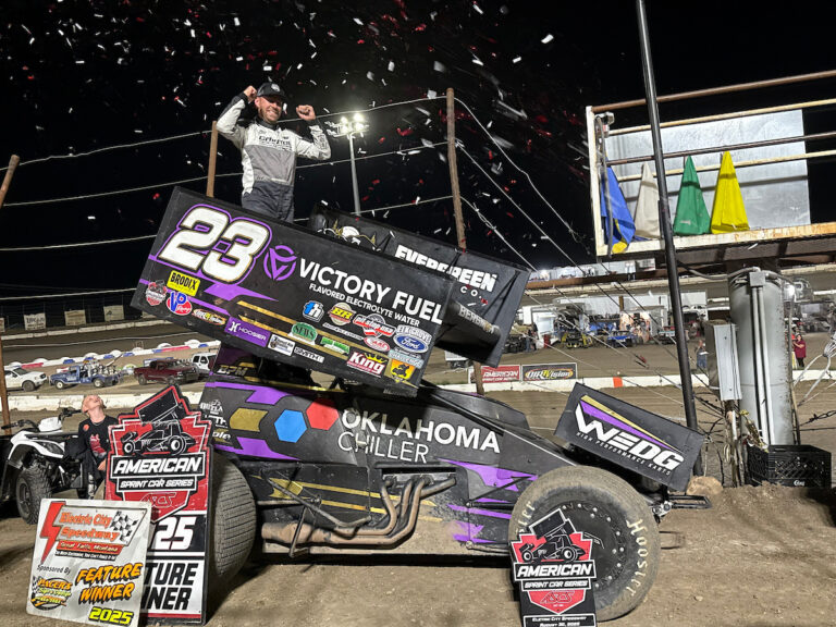 Sprint Car driver Seth Bergman celebrating atop his car in Electric City Speedway Victory Lane after winning an American Sprint Car Series event
