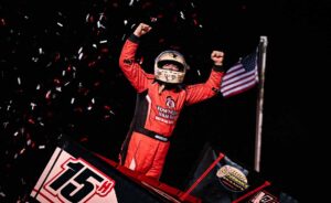 Sam Hafertepe celebrates with American flag in background