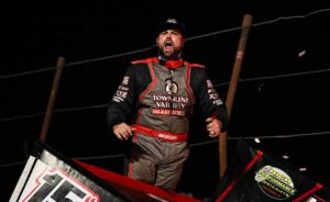 Sam Hafertepe Jr yelling at top of car after winning