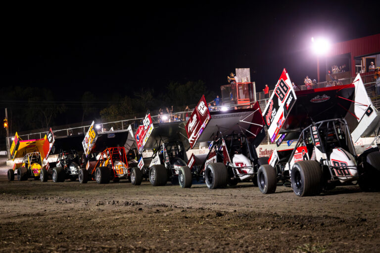 Sprint Cars in line across RPM Speedway frontstretch