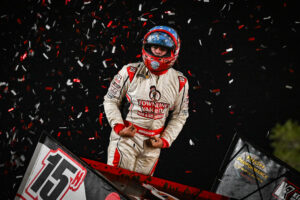 Sam Hafertepe Jr celebrating atop his car