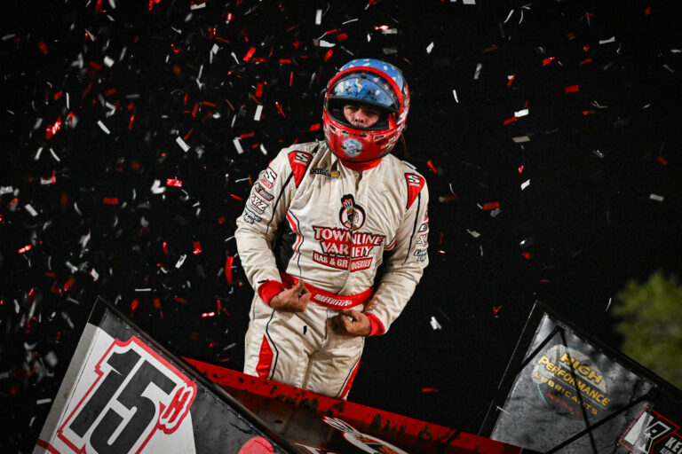 Sam Hafertepe Jr celebrating atop his car